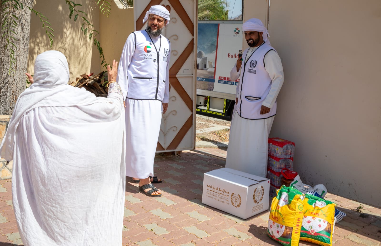 International Charity Organization volunteers distribute food parcels and essential supplies to a needy family in the UAE ahead of Eid Al Adha.